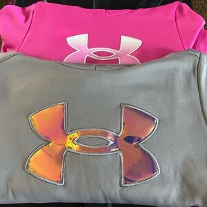 A pair of Under Armour hoodies Gray & Hot Pink.